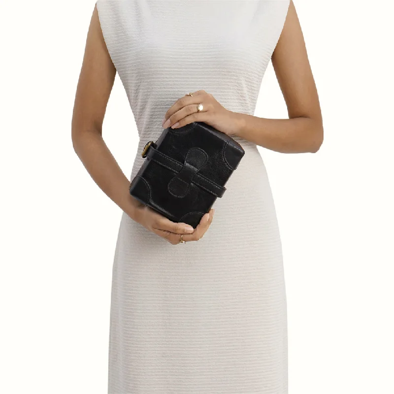 Mother - of - pearl clutch with a delicate sheenSMALL BOXY SLING BAG