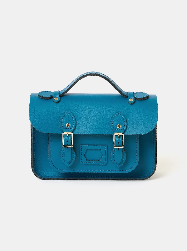 Laser - cut leather handle bag with a geometric pattern for a modern and edgy lookThe Mini - Shiz Blue with Bi-Colour Twisted Strap