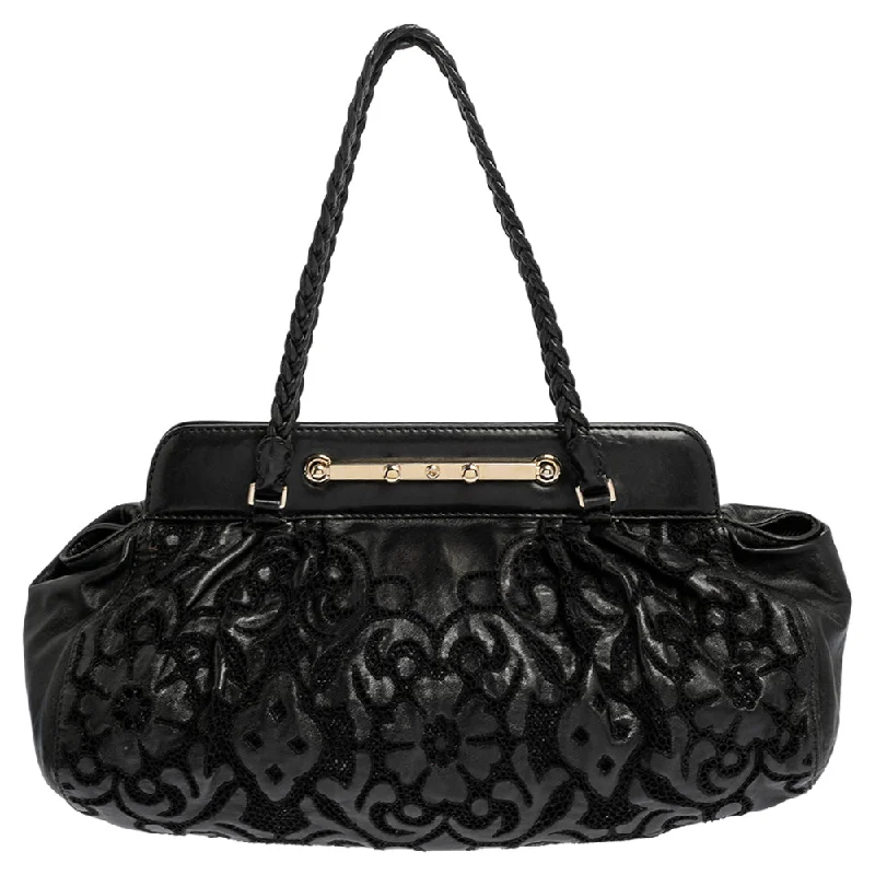 Faux fur satchel with a fluffy exterior for a winter fashion statementValentino  Leather Floral Embroidered Frame Satchel