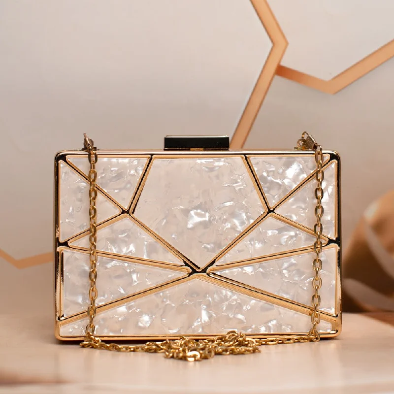 Velvet clutch with a tassel detail for a bohemian - chic styleWhite Acrylic MOP Cutout Metal Clutch