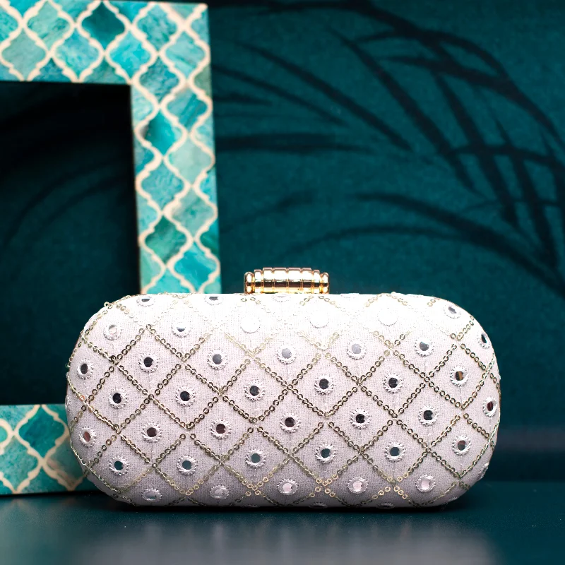 Mother - of - pearl clutch with a delicate sheenWhite Sequins Checks Capsule Clutch