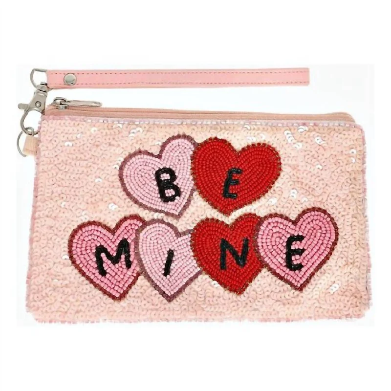 Laser - cut leather evening bag with an intricate patternWomen's Be Mine Seed Bead Wristlet In Pink